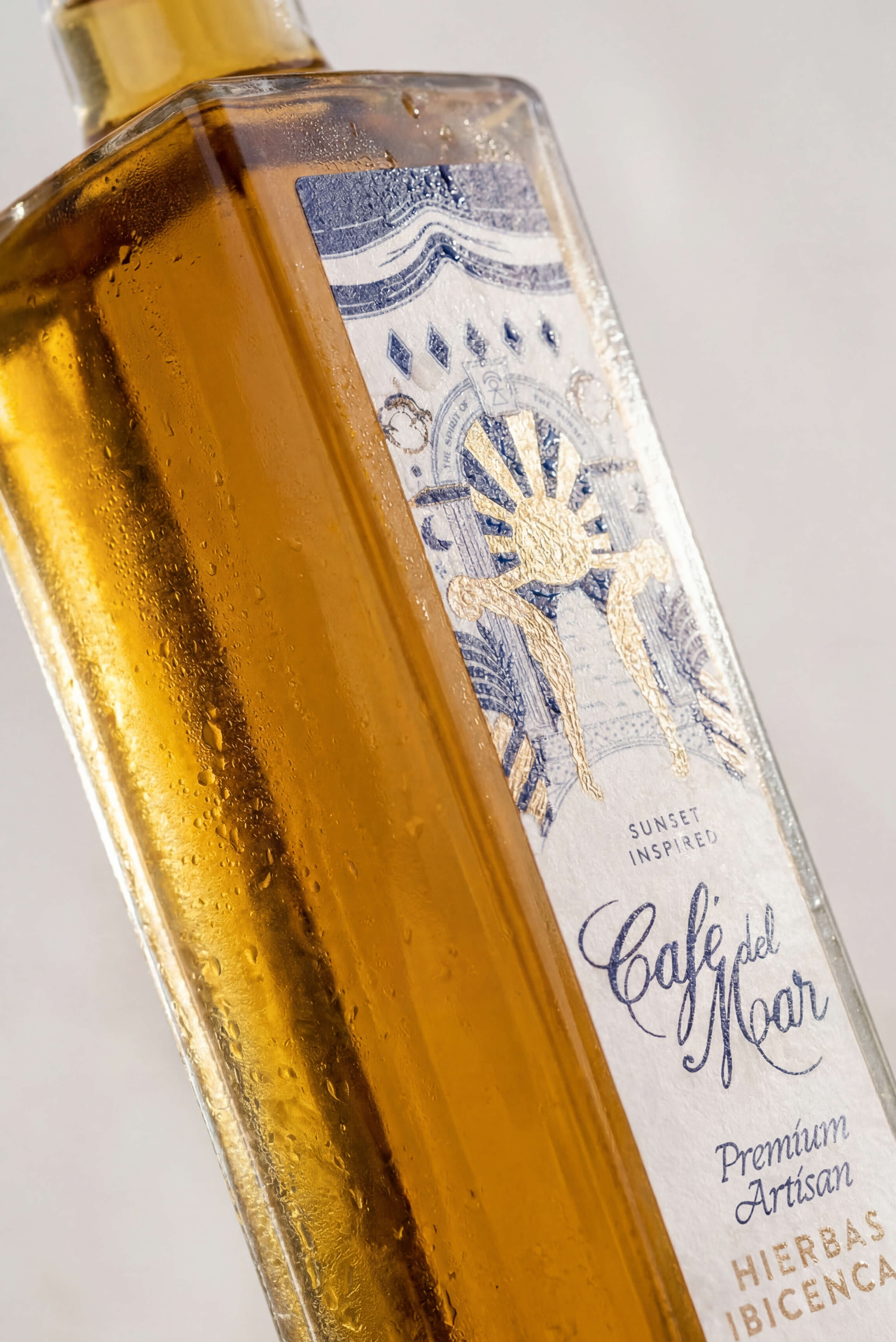 Café del Mar Hierbas Ibicencas bottle at sunset
