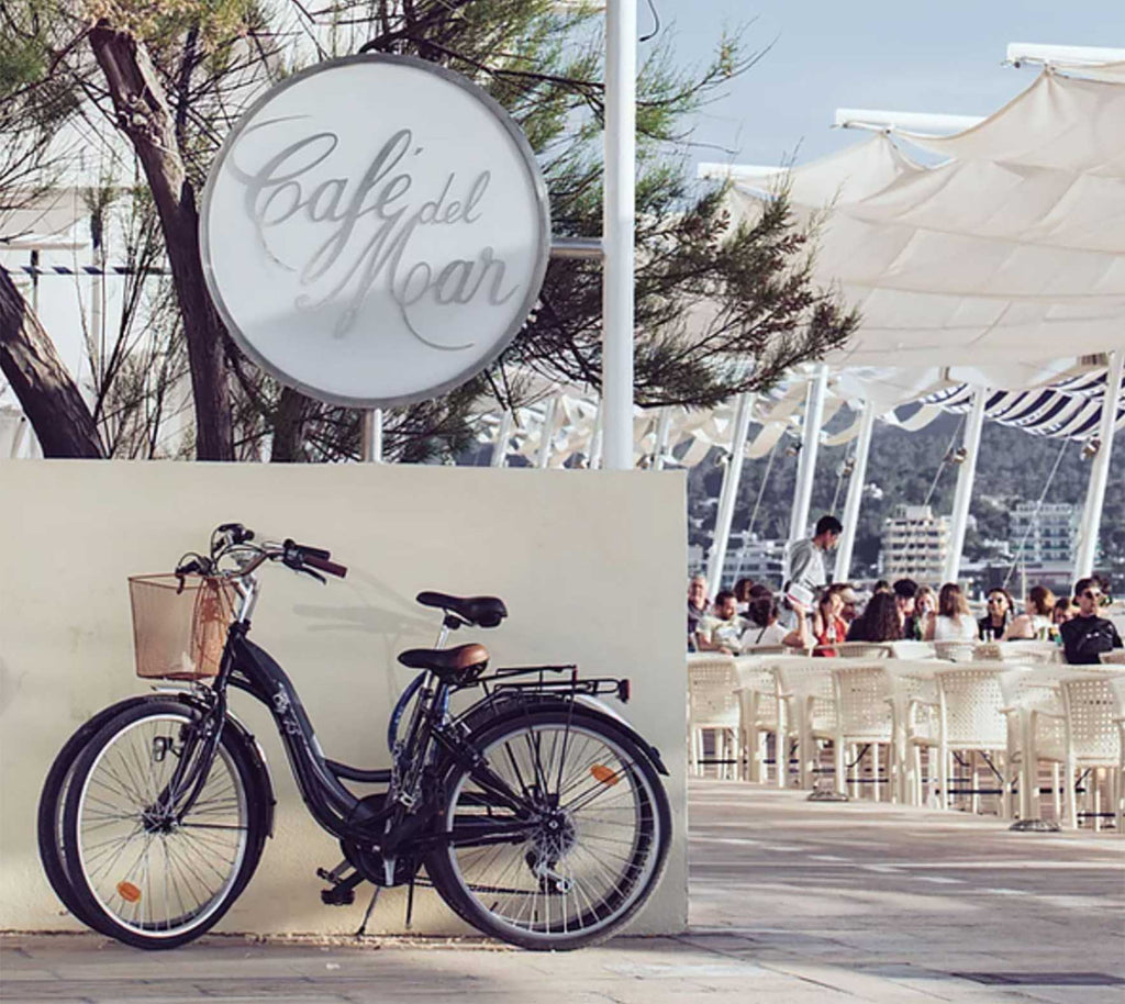 A bicycle parked outside Café del Mar on a beautiful sunny day