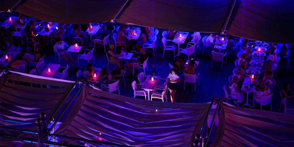 The bustling terrace of Café del Mar at night